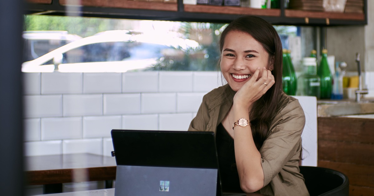 Writer smiling with laptop