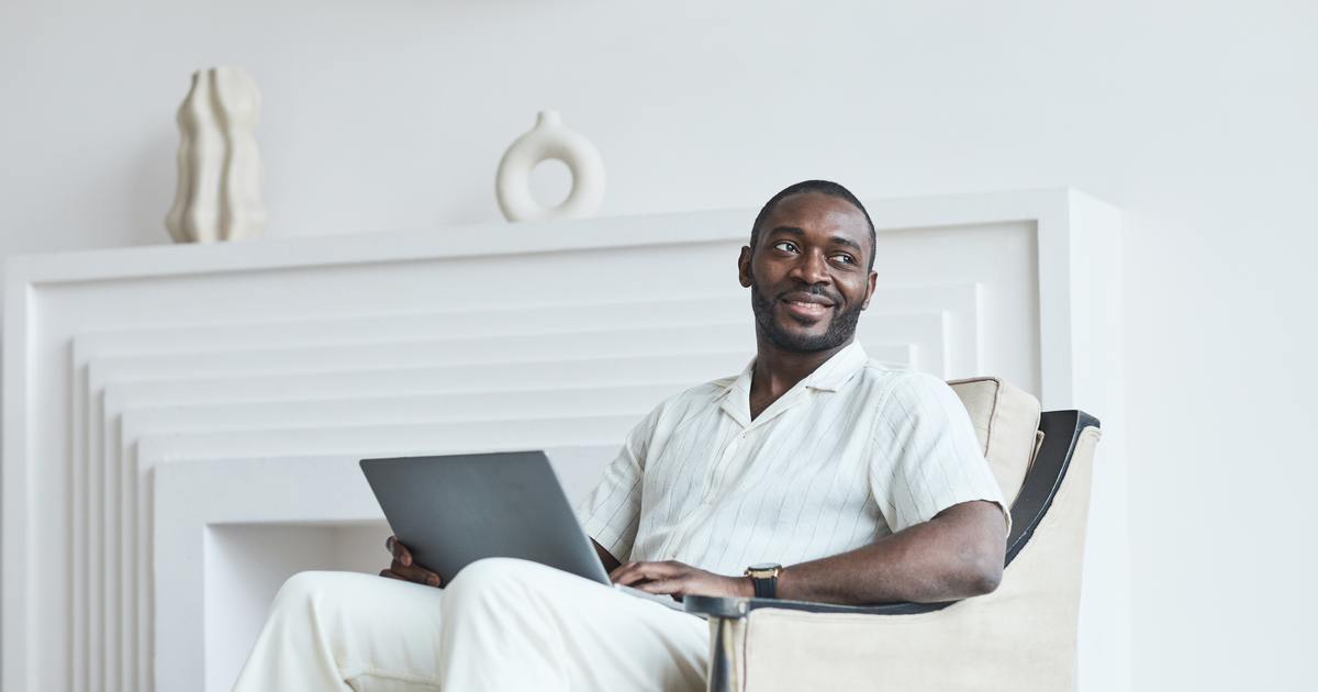 Writer sitting in a chair with laptop