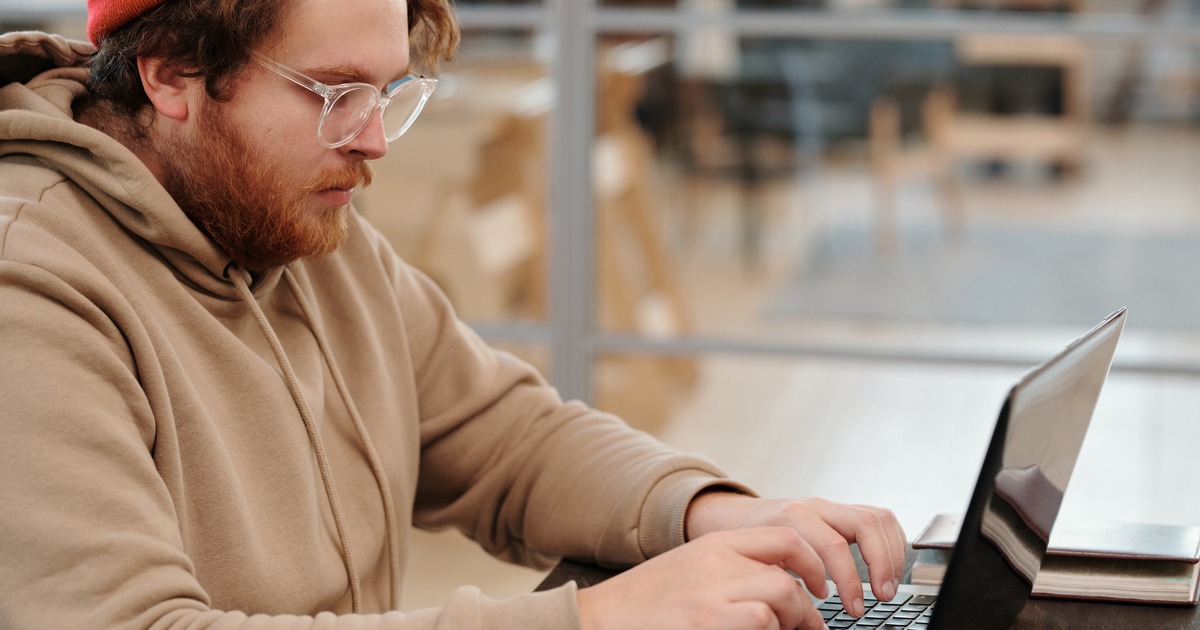 Writer typing on laptop