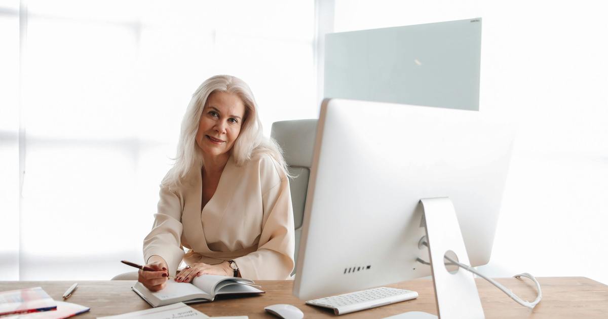 Writer smiling sitting at desk