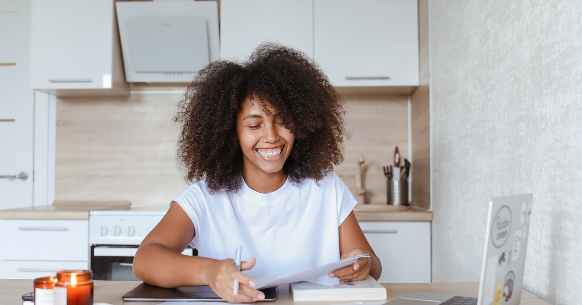 Writer smiling with laptop