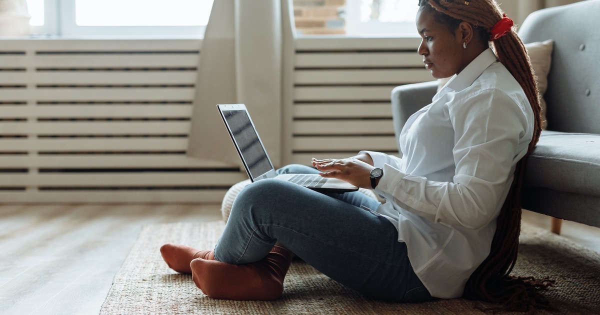 Writer typing on a laptop