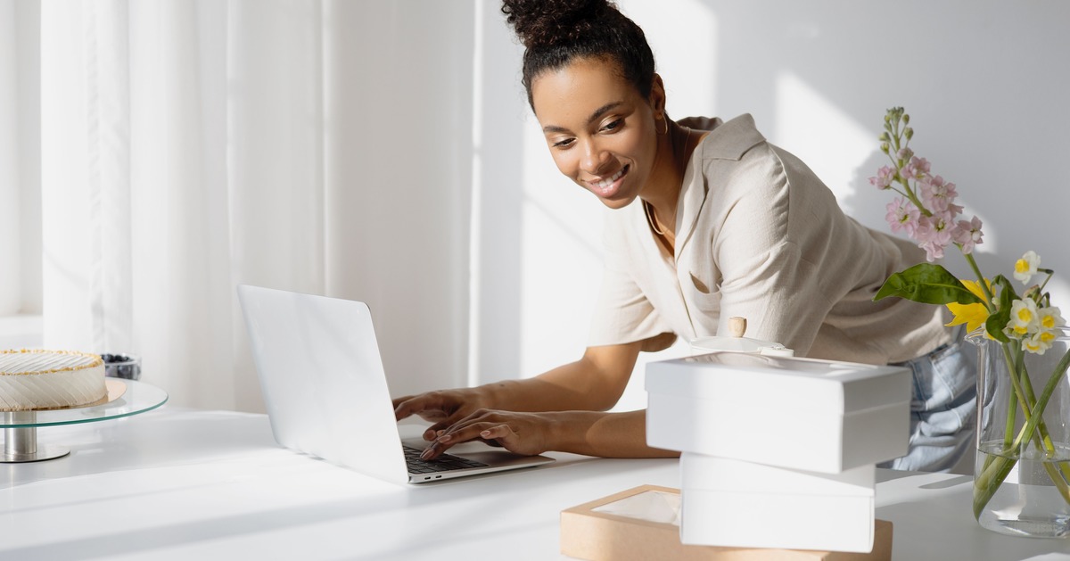 Writer typing on a laptop