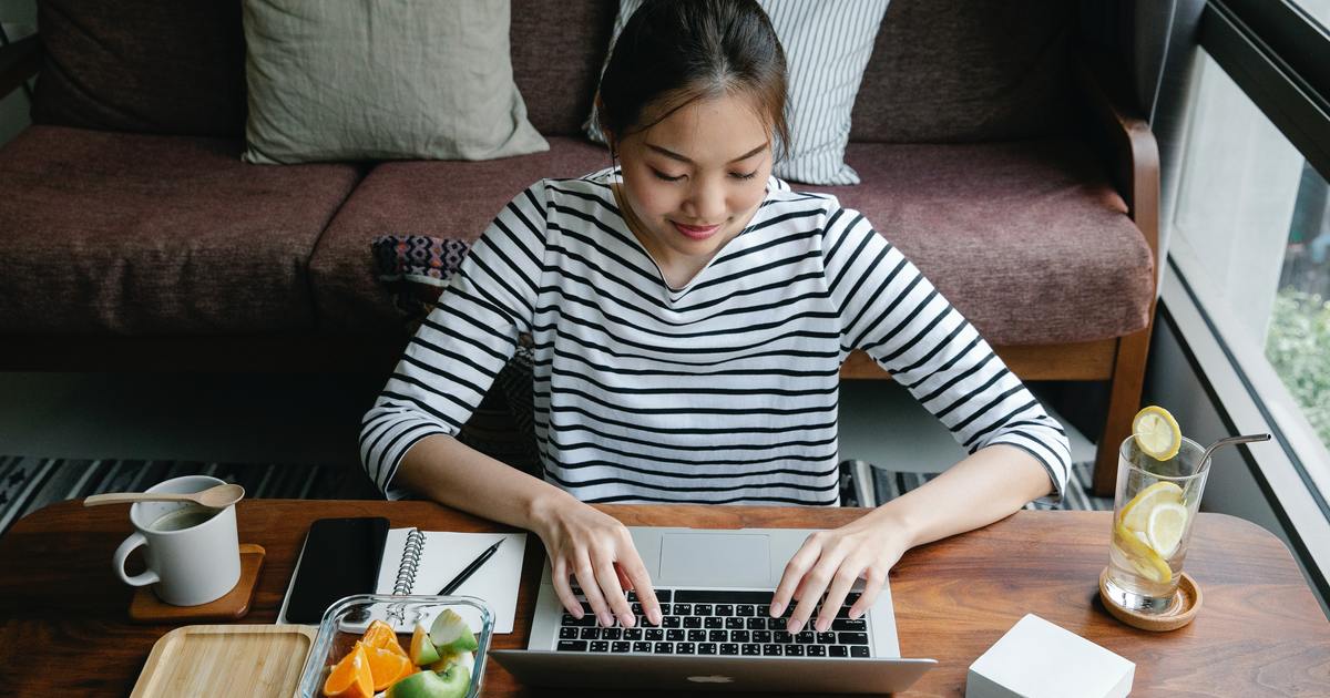 Writer sitting on floor with laptop